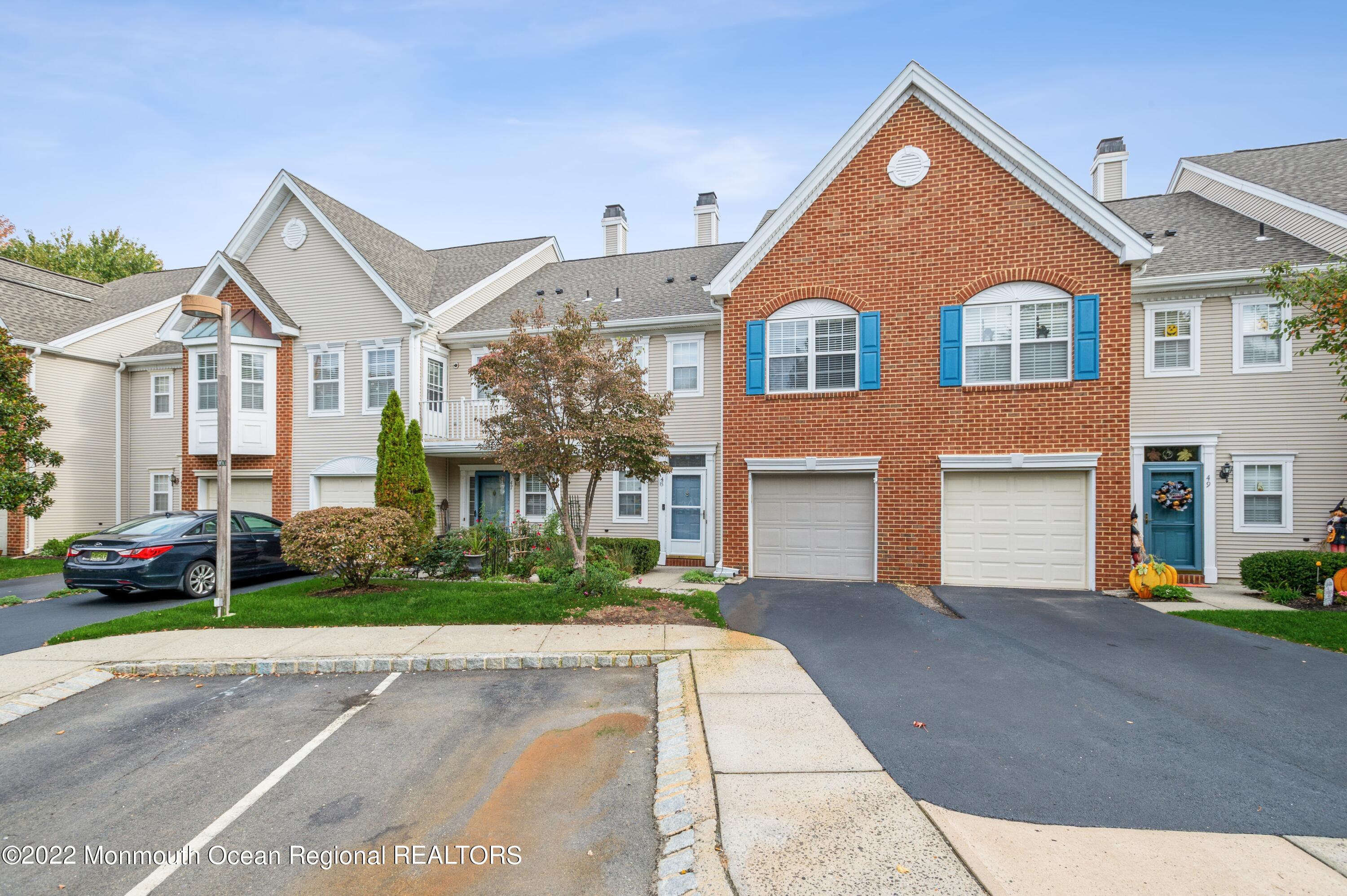 48 Alpine Road Holmdel, NJ 07733 - Photo 1 of 20 front view of a house with a street