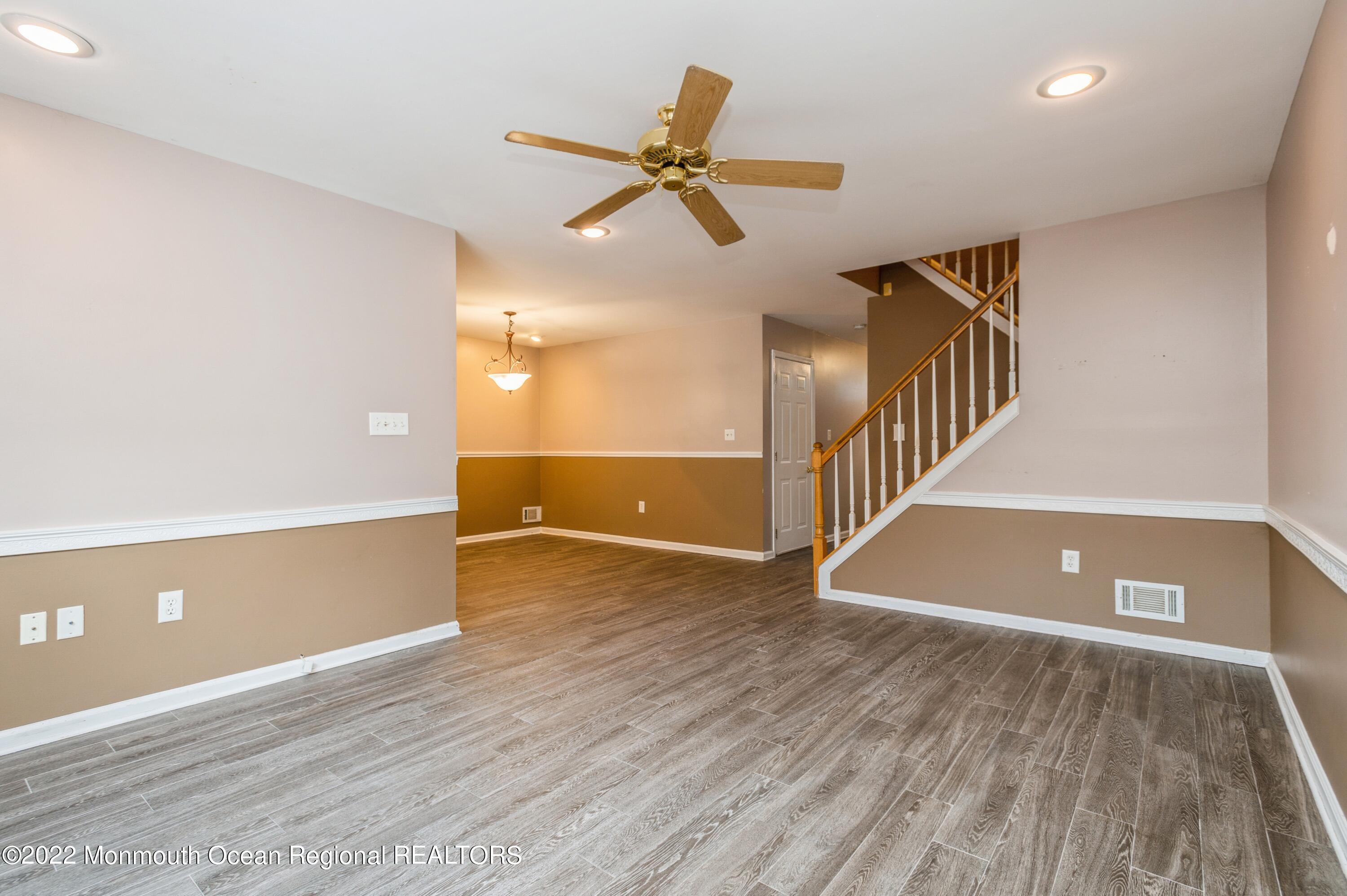48 Alpine Road Holmdel, NJ 07733 - Photo 7 of 20 wooden floor in an empty room with a window