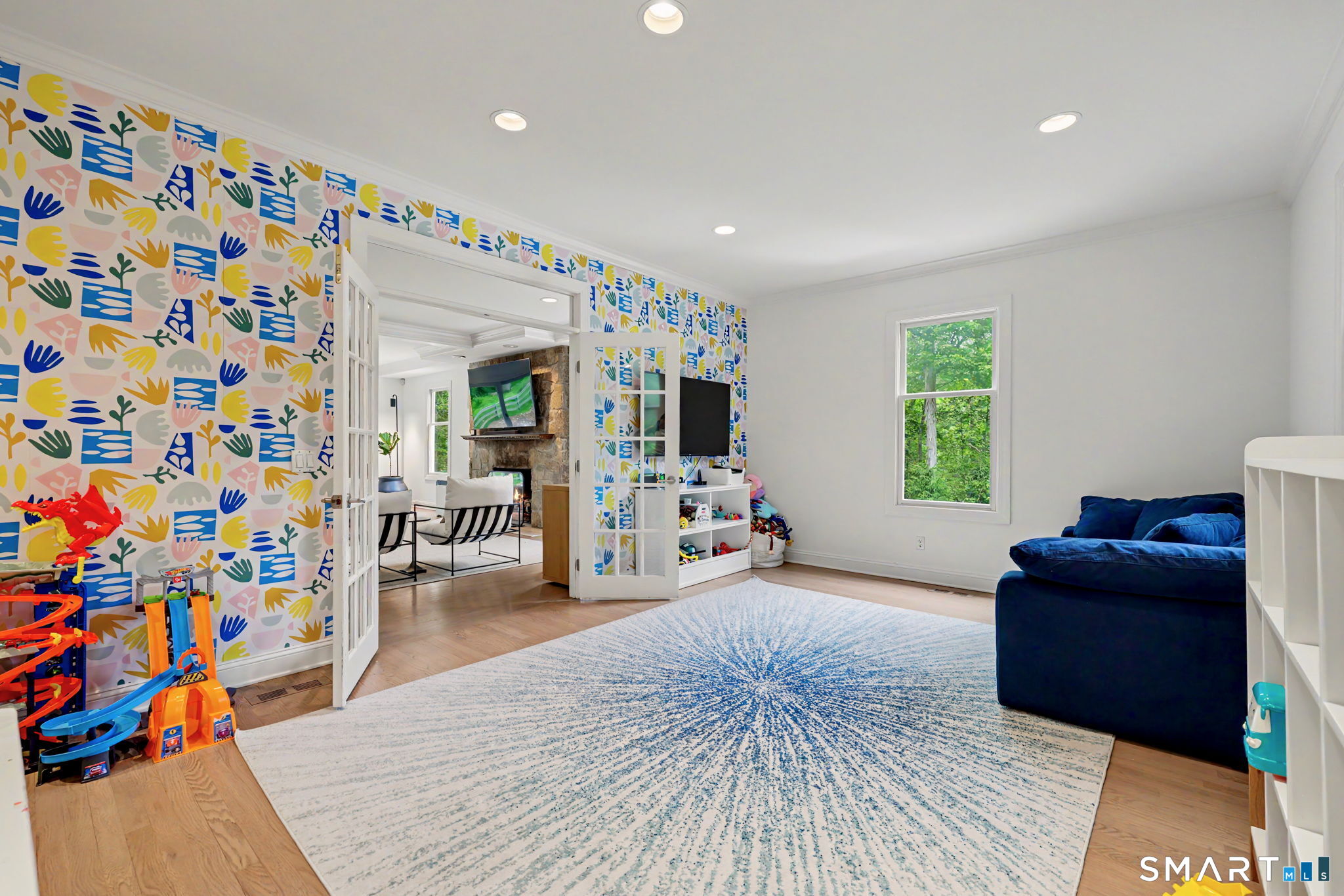 10 Side Hill Road Westport, CT 06880 - Photo 15 of 40 a living room with furniture and a flat screen tv