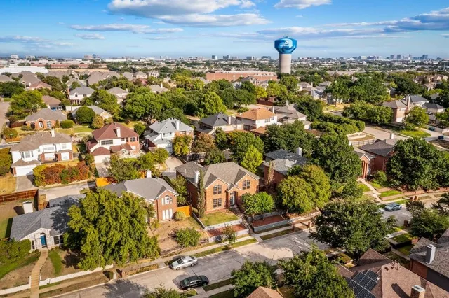 an aerial view of residential houses with outdoor space