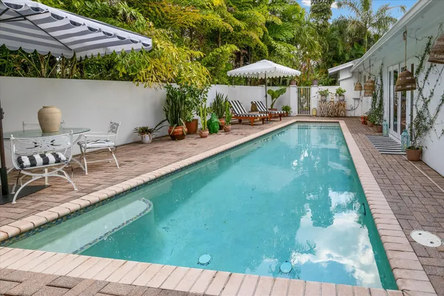 a view of a swimming pool with a patio