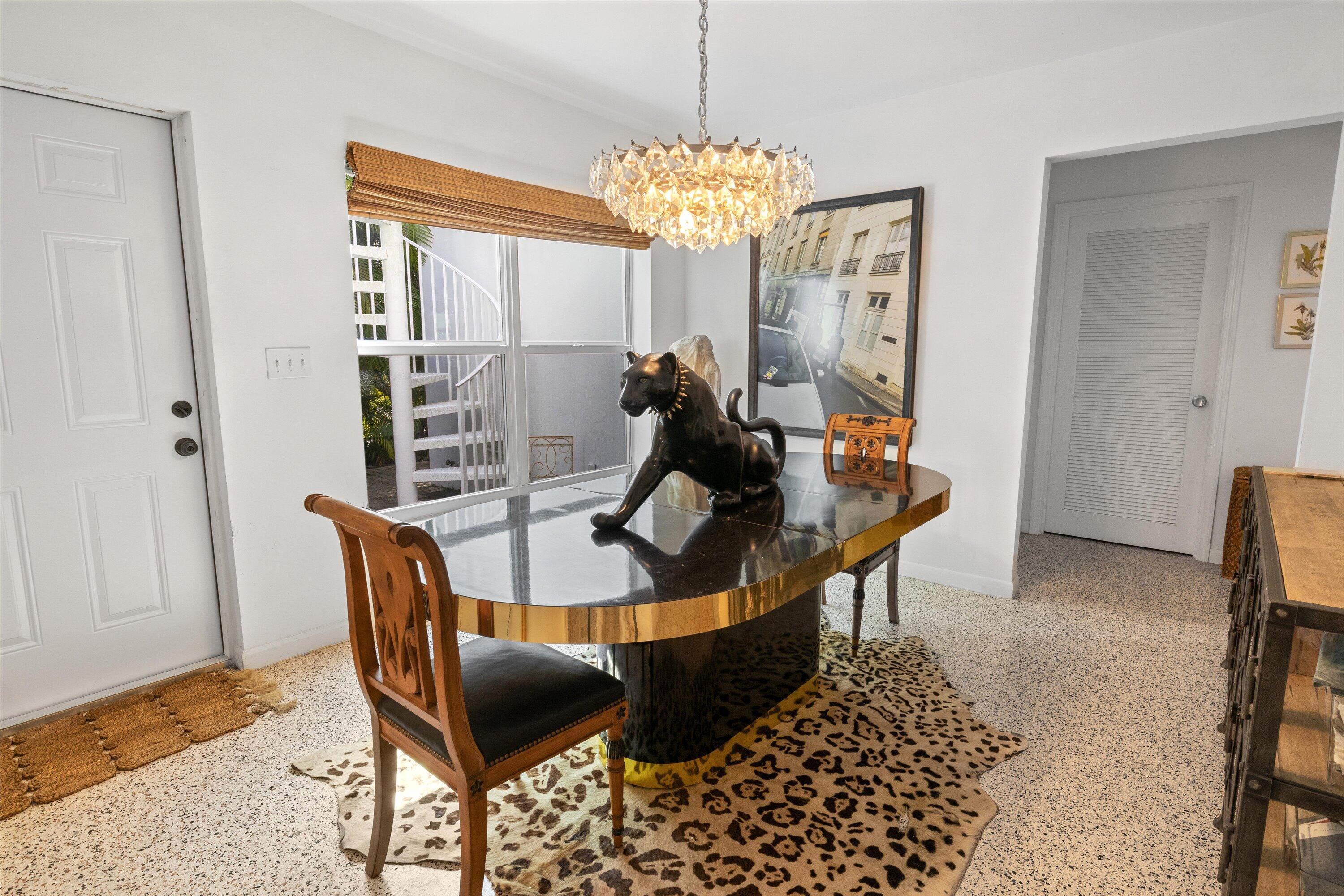 202 32nd Street West Palm Beach, FL 33407 - Photo 23 of 44 a view of a dining room with furniture and chandelier