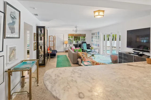 a living room with lots of furniture and a rug