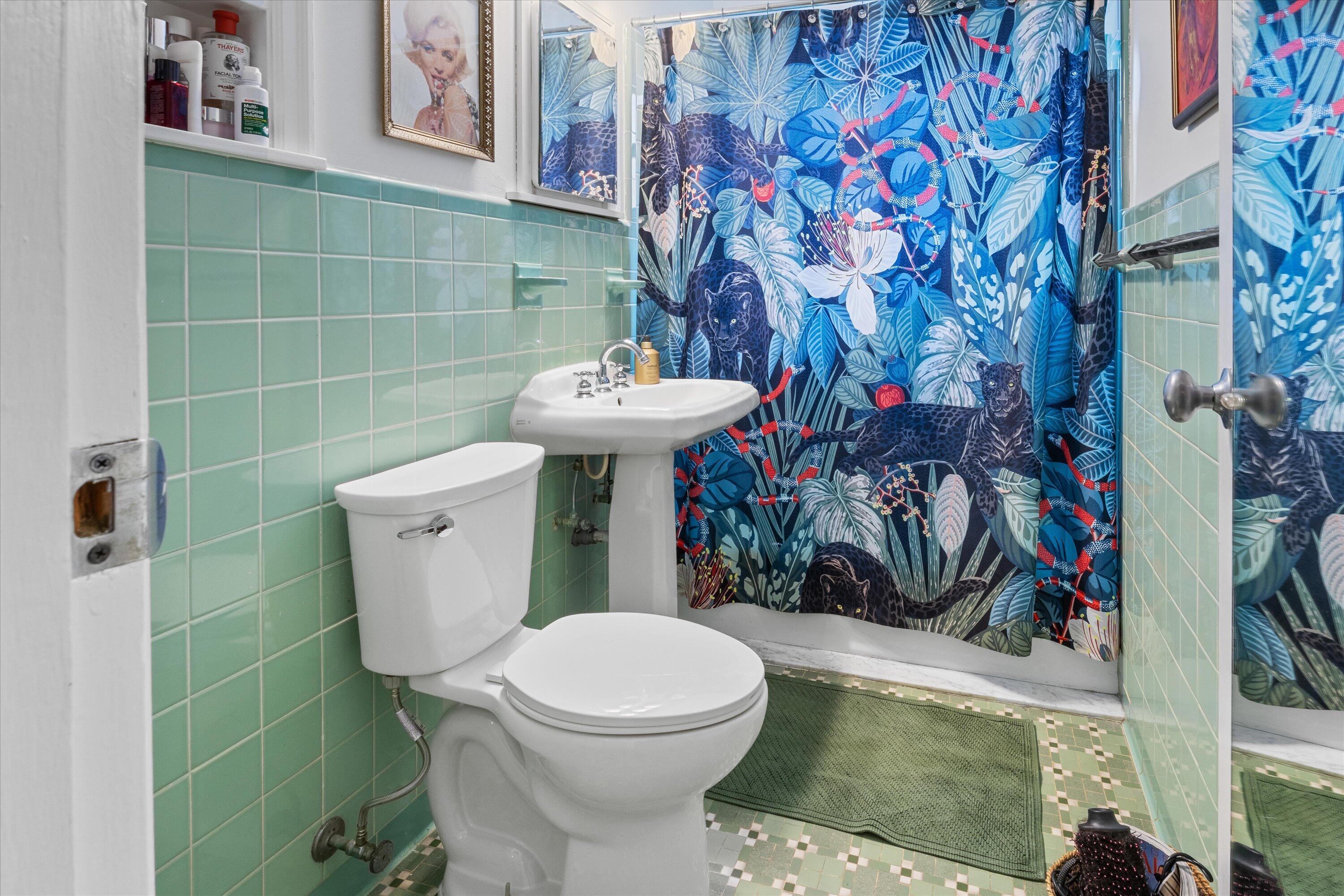 202 32nd Street West Palm Beach, FL 33407 - Photo 29 of 44 a bathroom with a toilet sink and shower