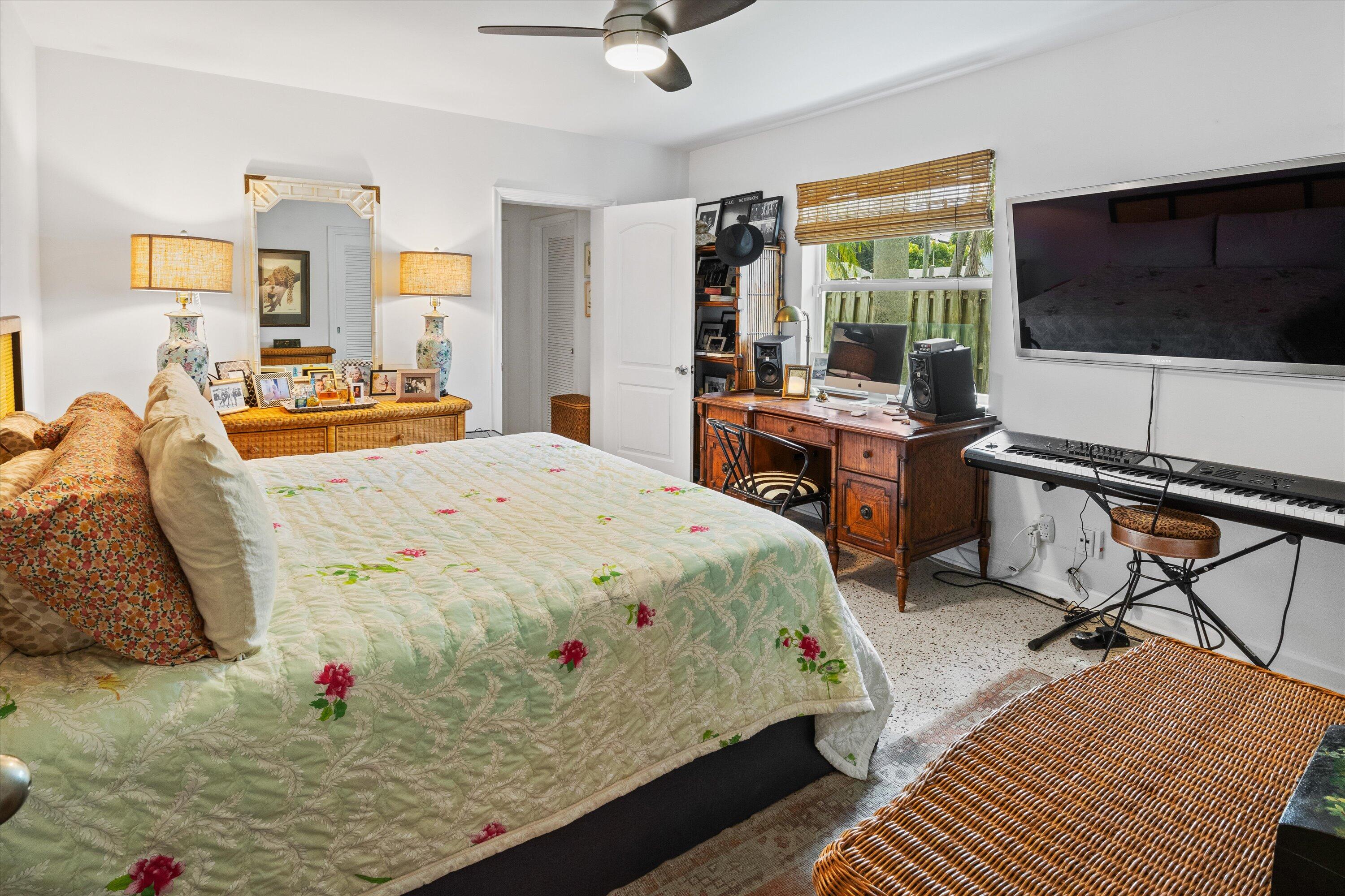 202 32nd Street West Palm Beach, FL 33407 - Photo 31 of 44 a bed room with a bed tv and a window