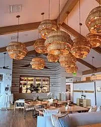 a view of a swimming pool with a lounge chair and palm trees