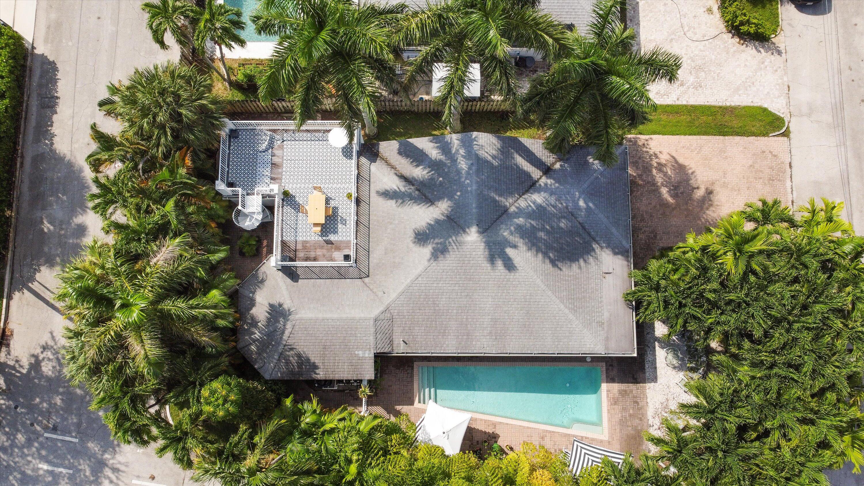 202 32nd Street West Palm Beach, FL 33407 - Photo 4 of 44 an aerial view of a house with a yard and garden