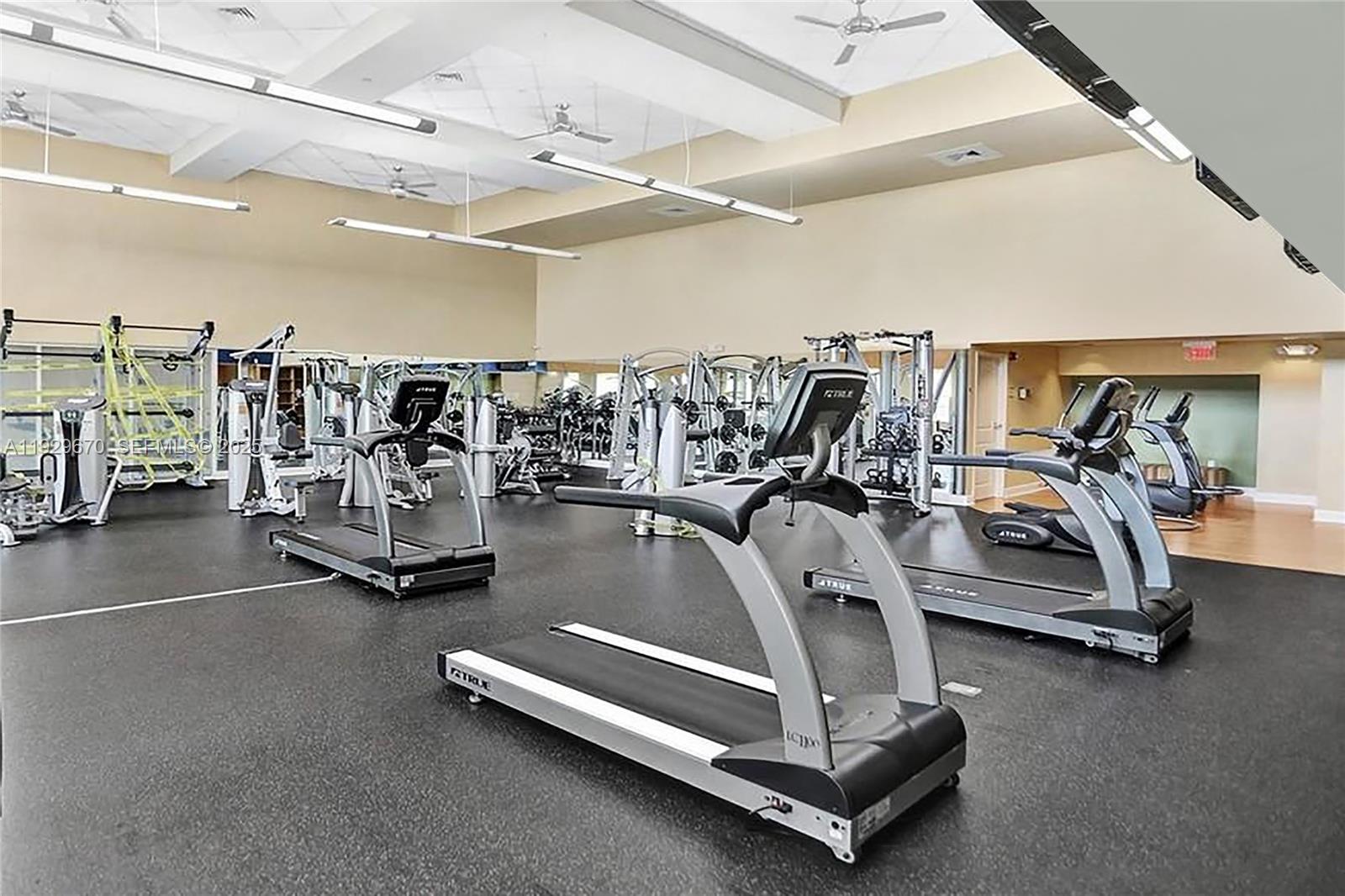 7350 Southwest 89th Street, Unit 1702S Miami, FL 33156 - Photo 15 of 29 a view of a gym with gym equipment