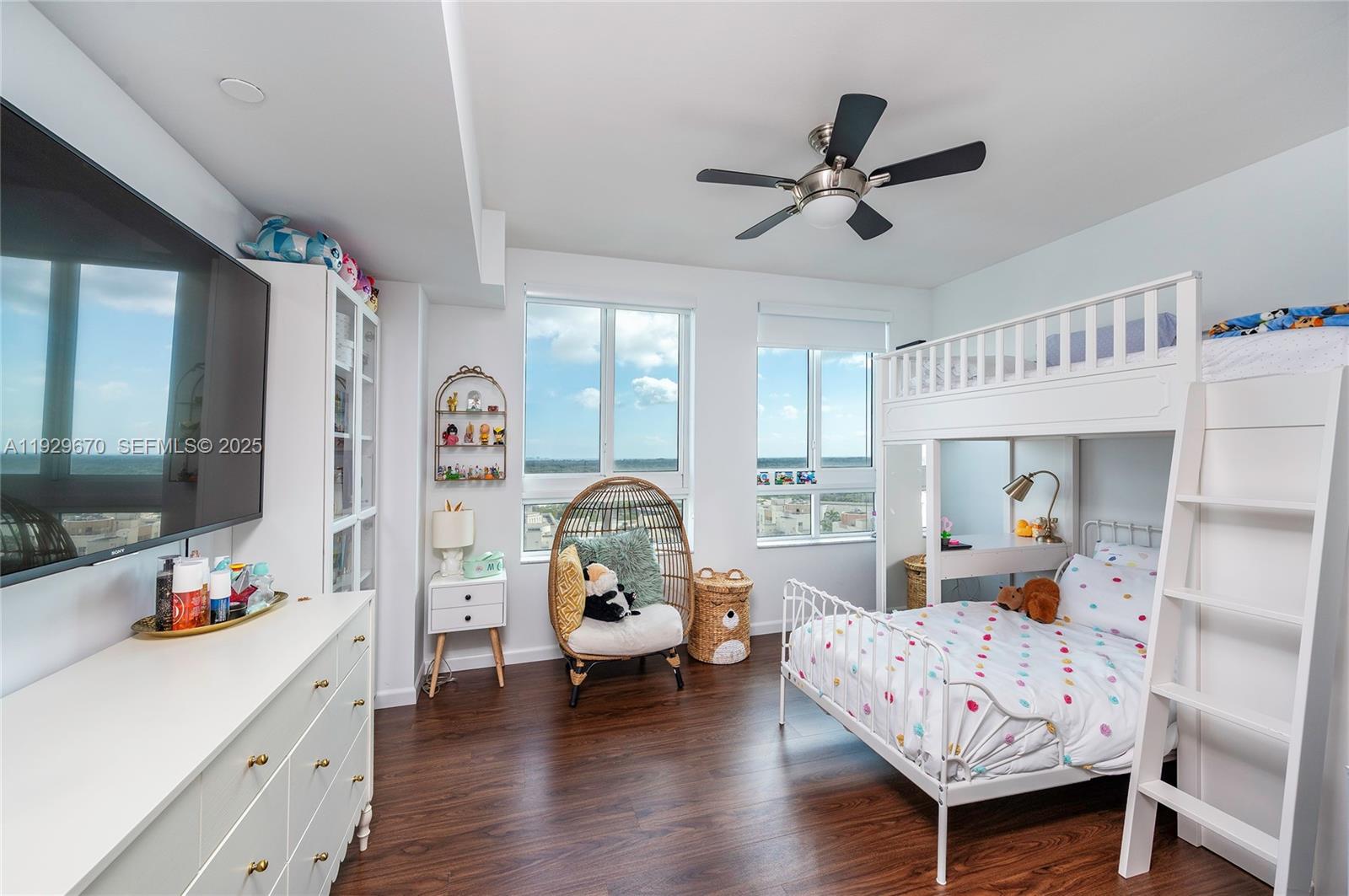 7350 Southwest 89th Street, Unit 1702S Miami, FL 33156 - Photo 8 of 29 a bedroom with furniture and a large window