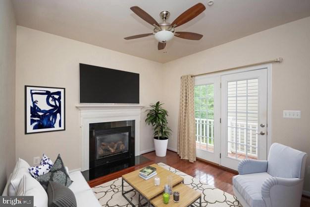 405 Signal Court, Unit 33 Bel Air, MD 21014 - Photo 13 of 43 a living room with furniture a flat screen tv and a fireplace
