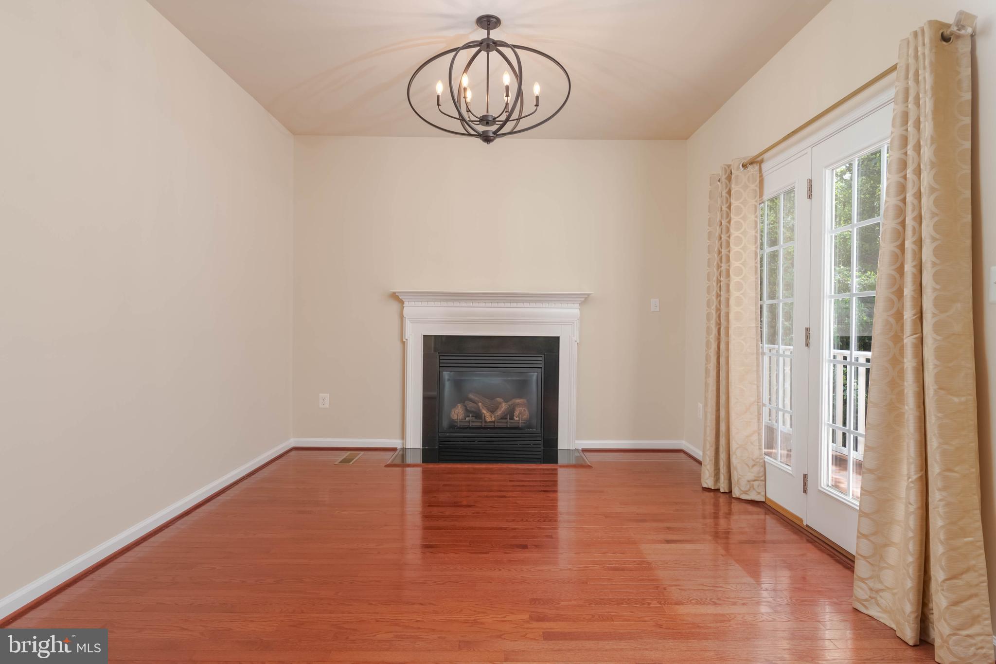 405 Signal Court, Unit 33 Bel Air, MD 21014 - Photo 15 of 43 a view of an empty room with wooden floor and a window
