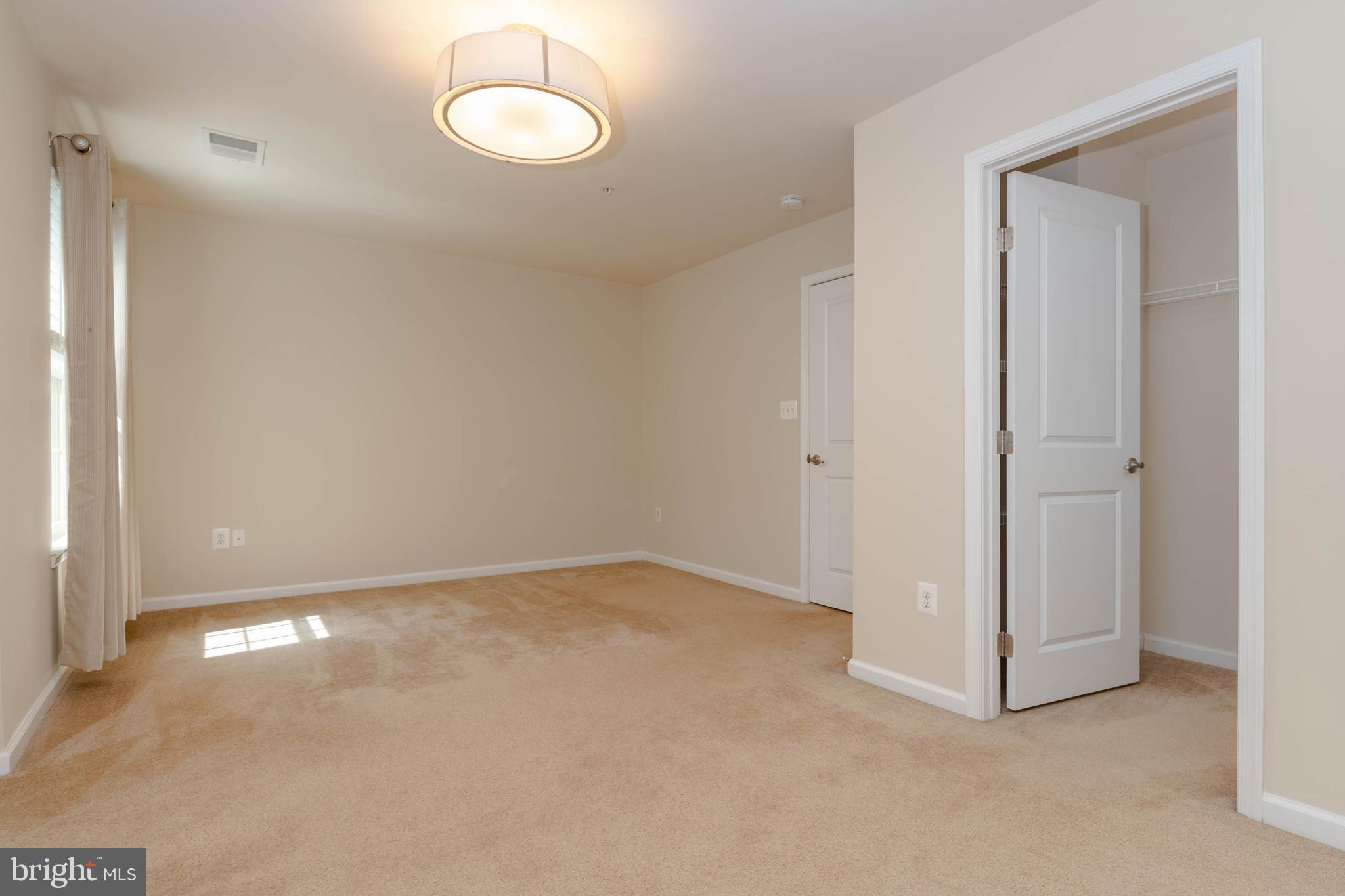 405 Signal Court, Unit 33 Bel Air, MD 21014 - Photo 19 of 43 an empty room with a fan and a window