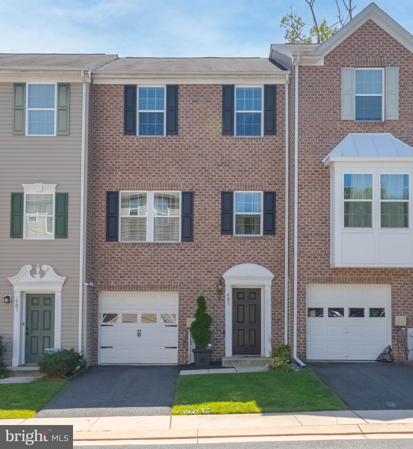 405 Signal Court, Unit 33 Bel Air, MD 21014 - Photo 2 of 43 a front view of a house with a yard and garage