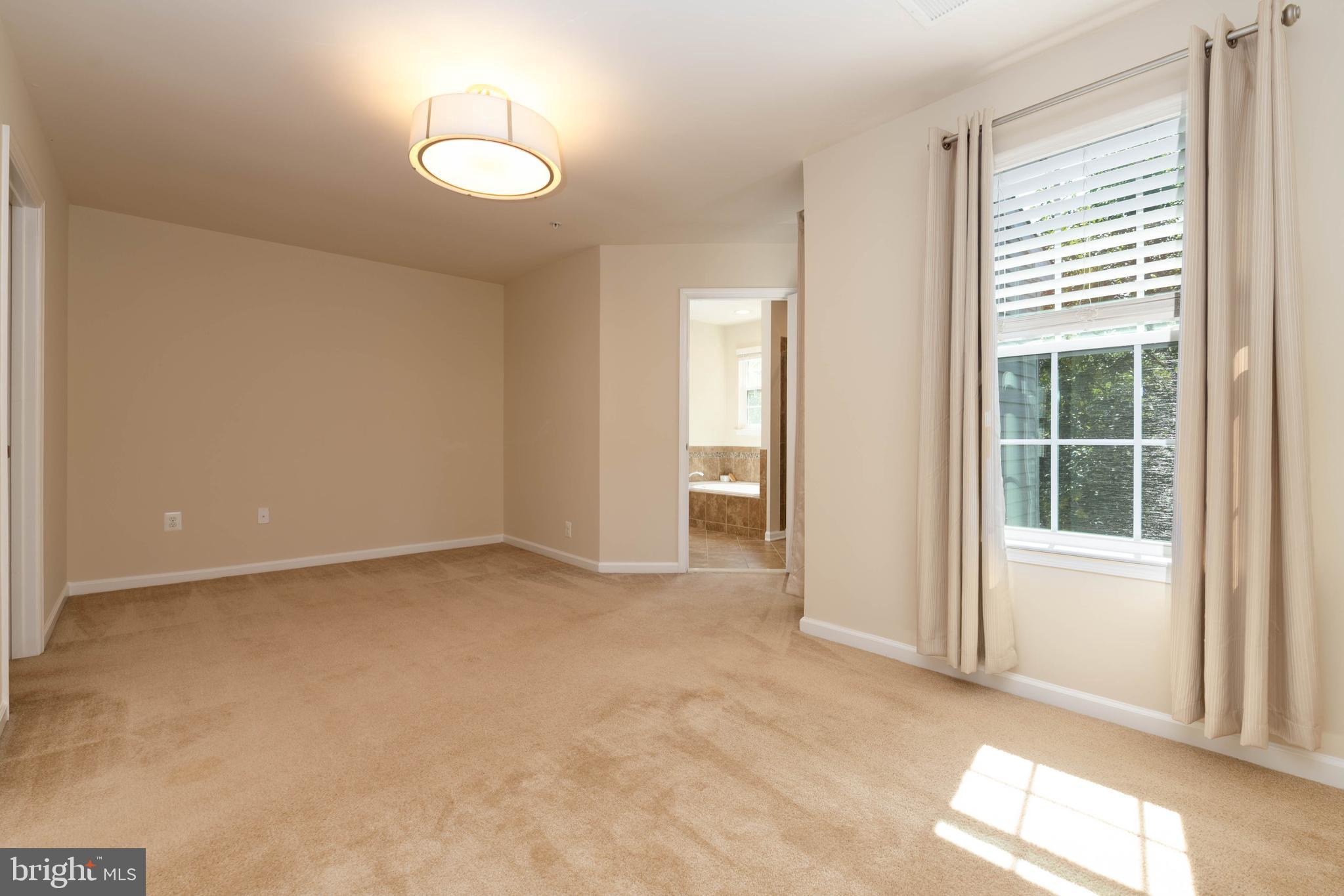 405 Signal Court, Unit 33 Bel Air, MD 21014 - Photo 20 of 43 an empty room with windows and yard