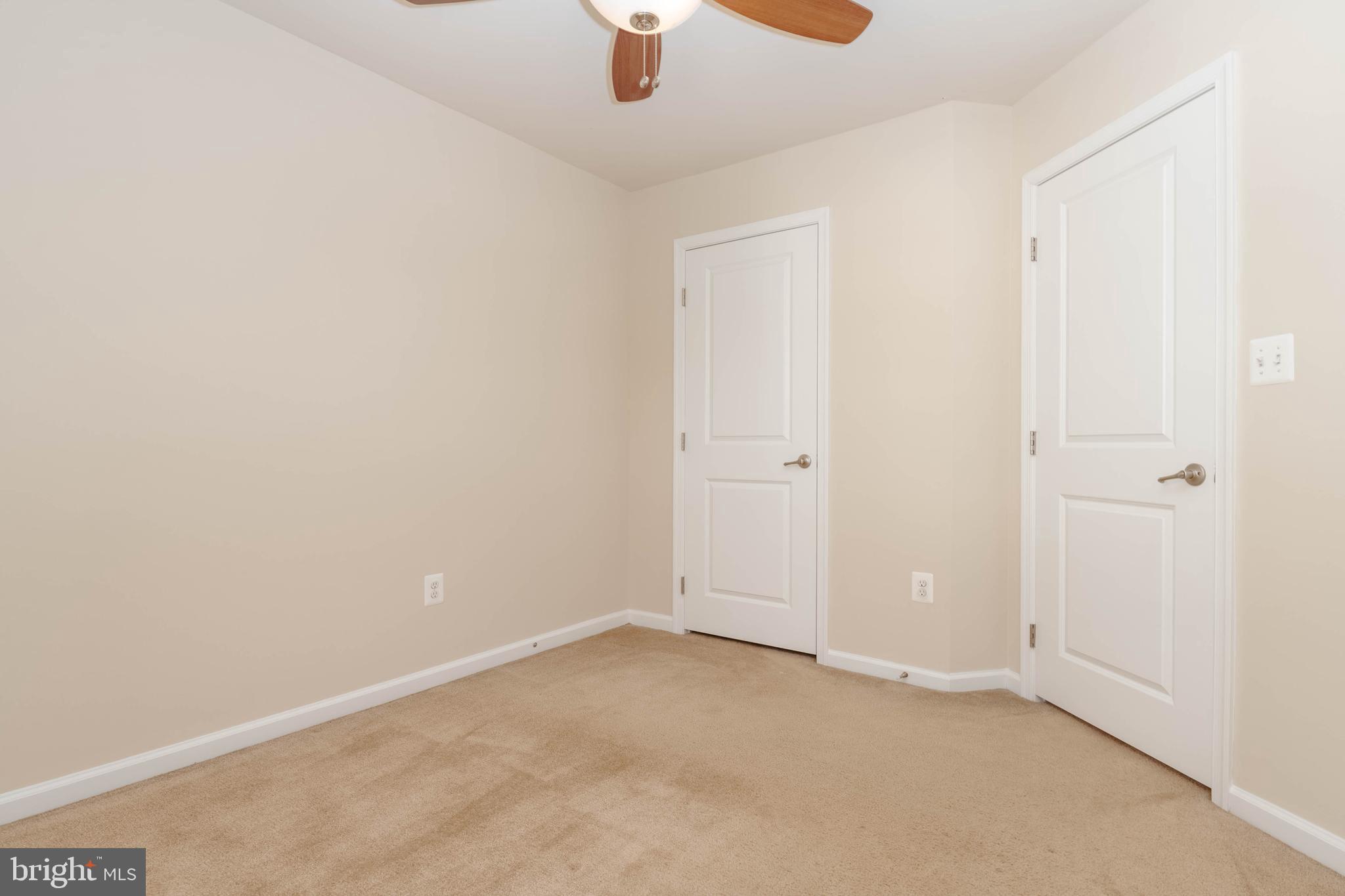 405 Signal Court, Unit 33 Bel Air, MD 21014 - Photo 26 of 43 an empty room with a ceiling fan and a window