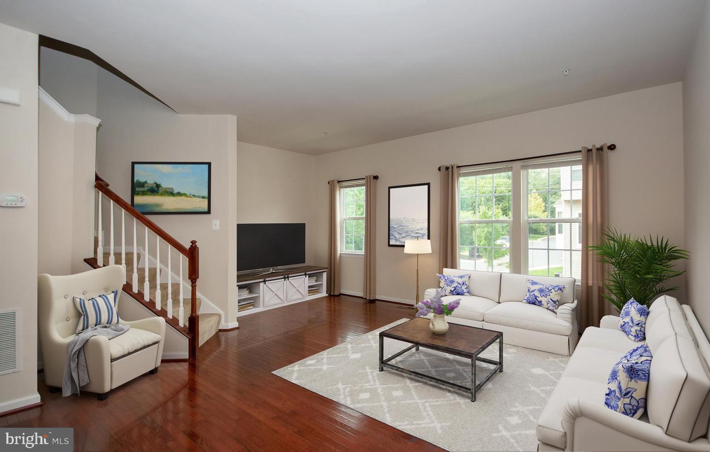 405 Signal Court, Unit 33 Bel Air, MD 21014 - Photo 3 of 43 a living room with furniture flat screen tv and a large window