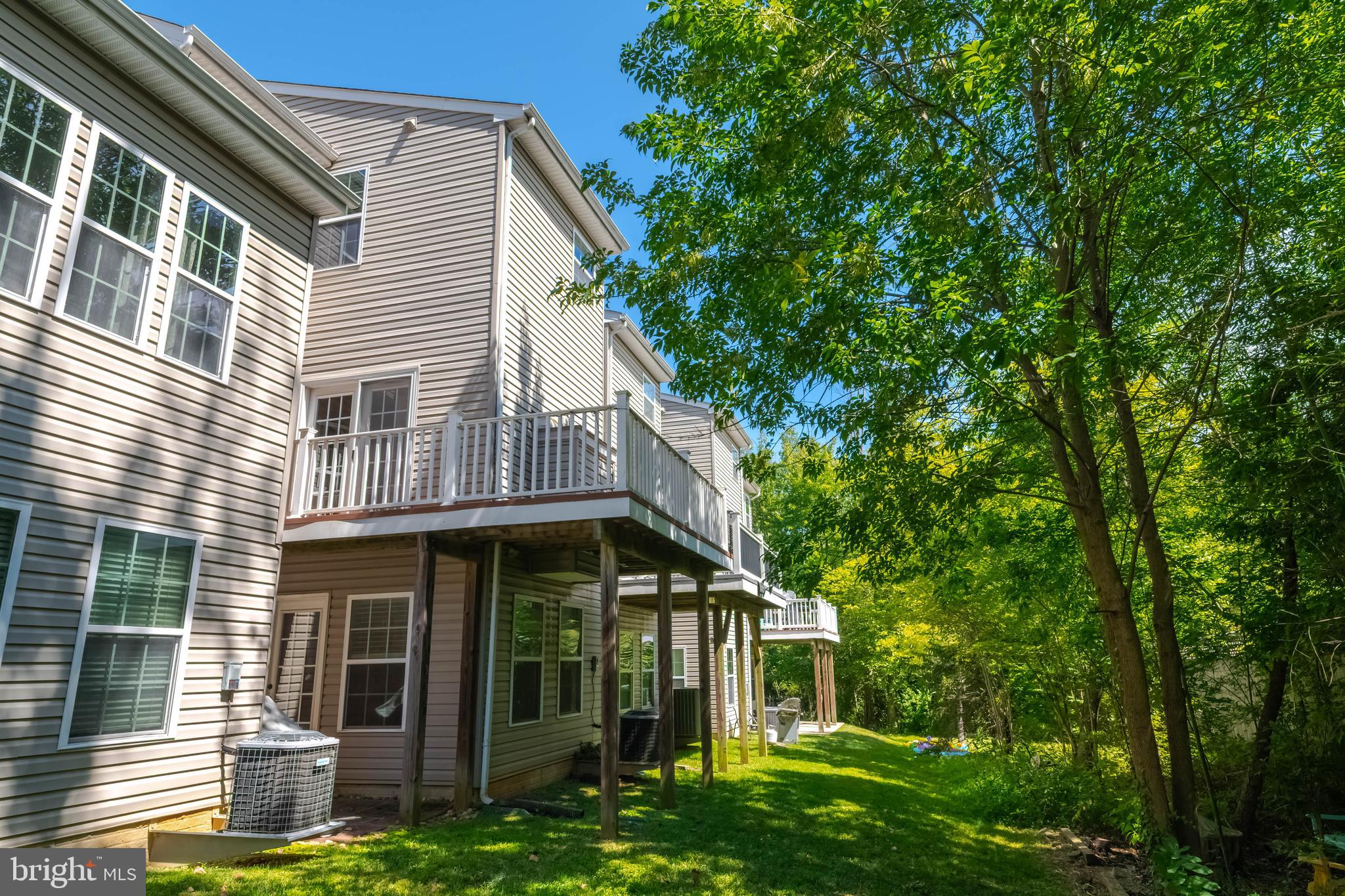 405 Signal Court, Unit 33 Bel Air, MD 21014 - Photo 37 of 43 a view of a house with brick walls and a tree