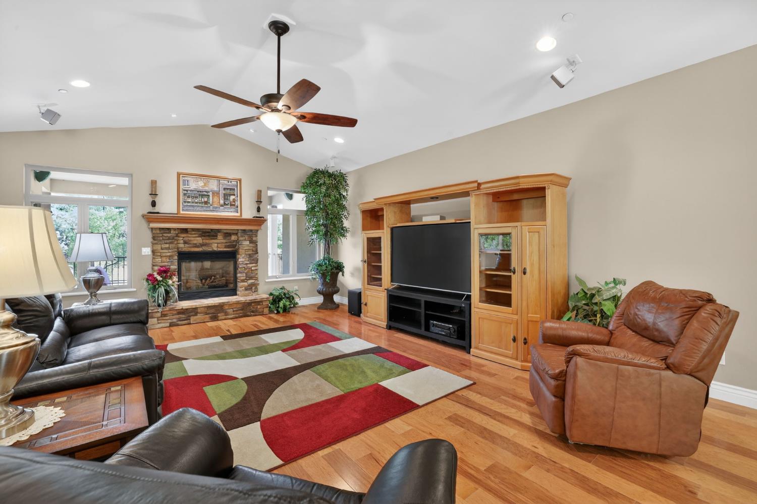 4554 Cross Creek Road Cool, CA 95614 - Photo 16 of 92 a living room with fireplace furniture and a flat screen tv