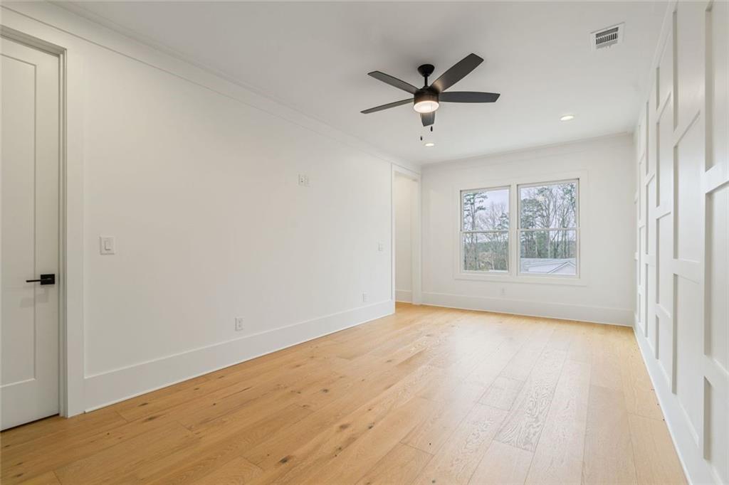 555 Lower Birmingham Road Canton, GA 30115 - Photo 76 of 104 a view of empty room with wooden floor and fan
