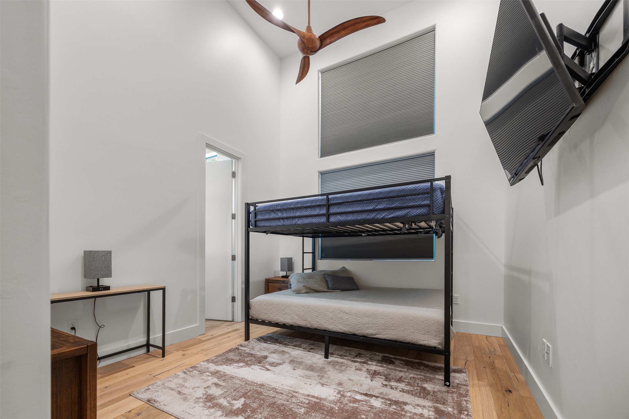 4103 Ridgelea Drive Austin, TX 78731 - Photo 20 of 26 Lofty ceilings complement light hardwood flooring in this cozy sleeping area.