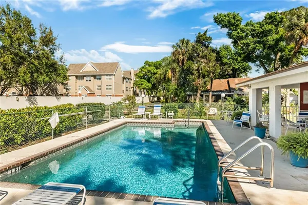 a swimming pool view with a outdoor space