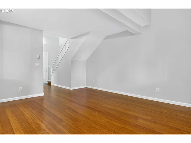 a kitchen with stainless steel appliances granite countertop a stove microwave and refrigerator