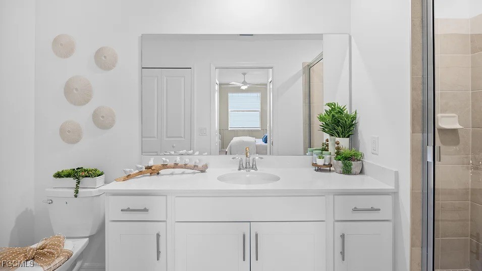 43985 Boardwalk Loop, Unit 2135 Punta Gorda, FL 33982 - Photo 13 of 48 a bathroom with a sink a vanity and a mirror