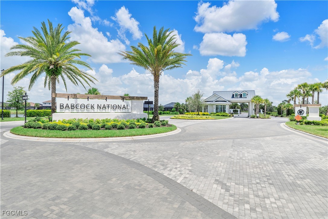 43985 Boardwalk Loop, Unit 2135 Punta Gorda, FL 33982 - Photo 14 of 48 a view of a street with a cars parked and small yard