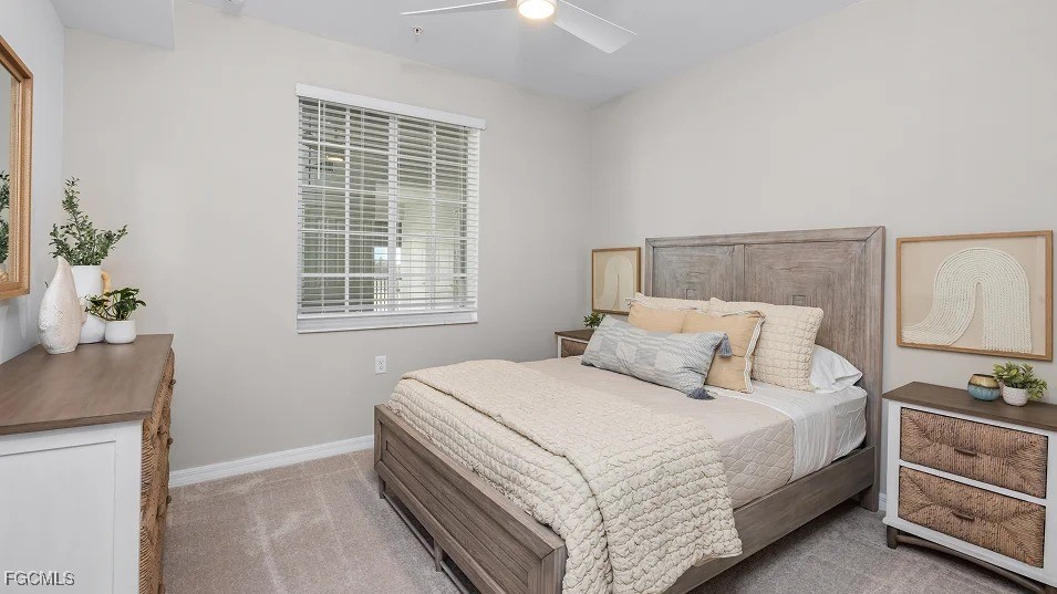 43985 Boardwalk Loop, Unit 2135 Punta Gorda, FL 33982 - Photo 4 of 48 a bedroom with a bed and a potted plant