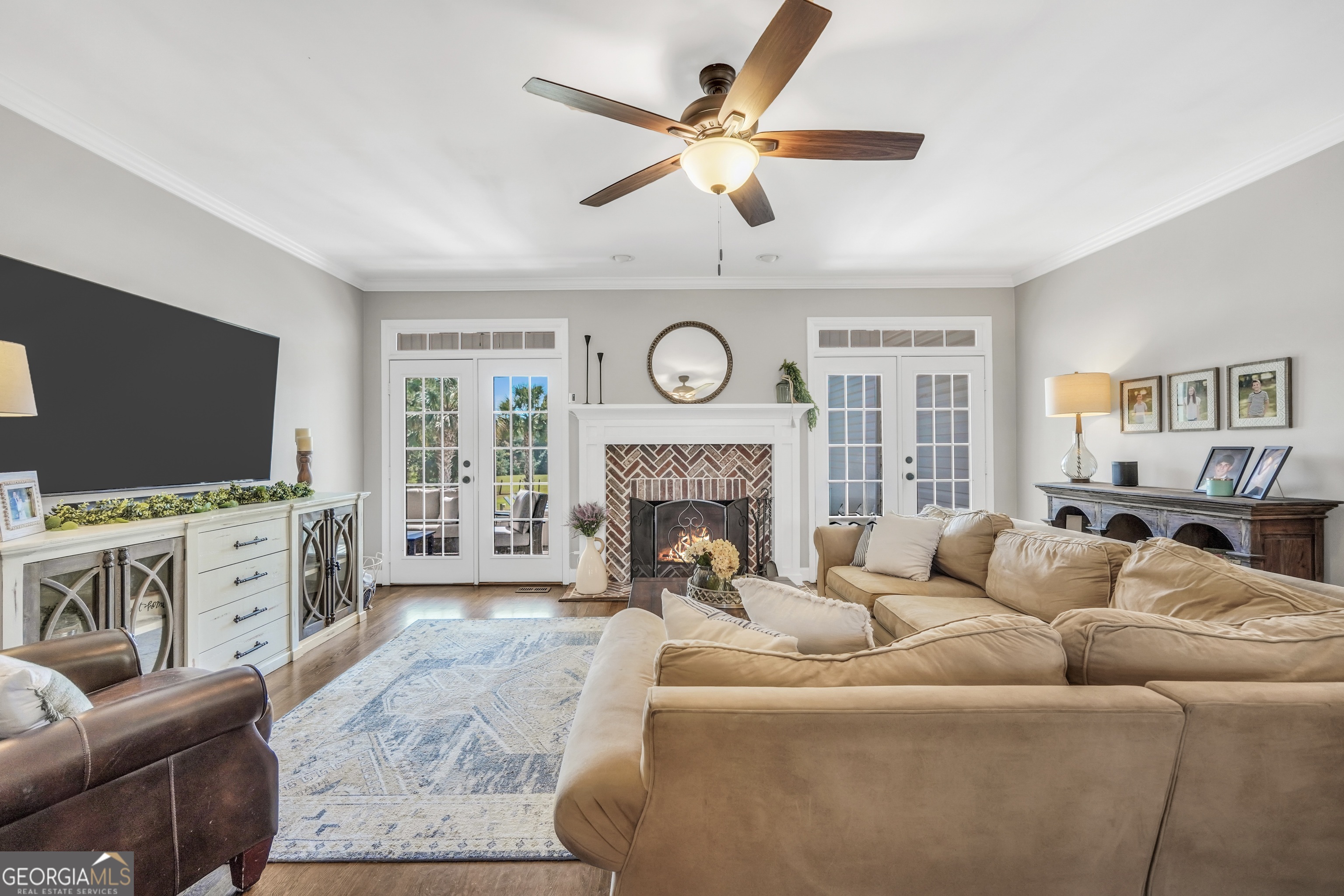 1964 East Lake Road McDonough, GA 30252 - Photo 18 of 99 a living room with furniture a flat screen tv and a fireplace