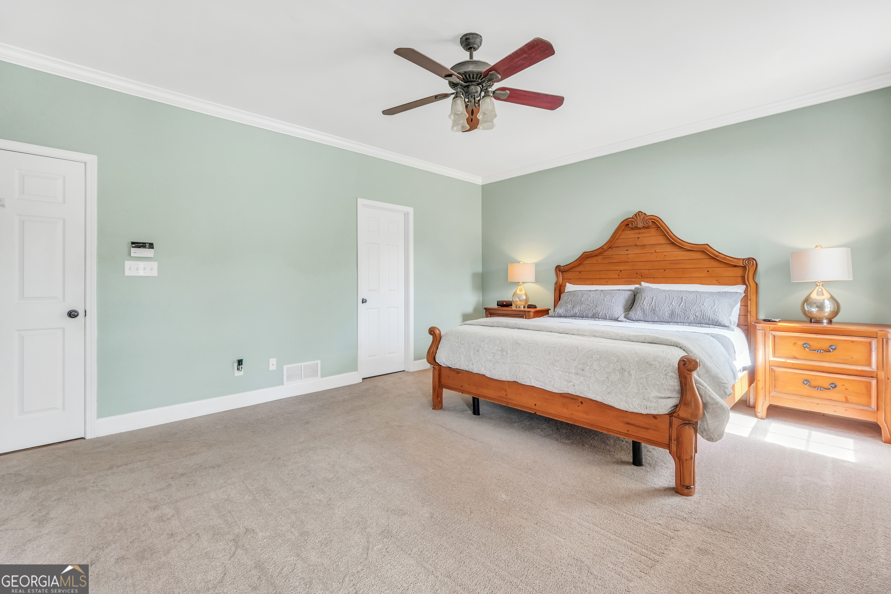 1964 East Lake Road McDonough, GA 30252 - Photo 35 of 99 a bedroom with a bed and a ceiling fan