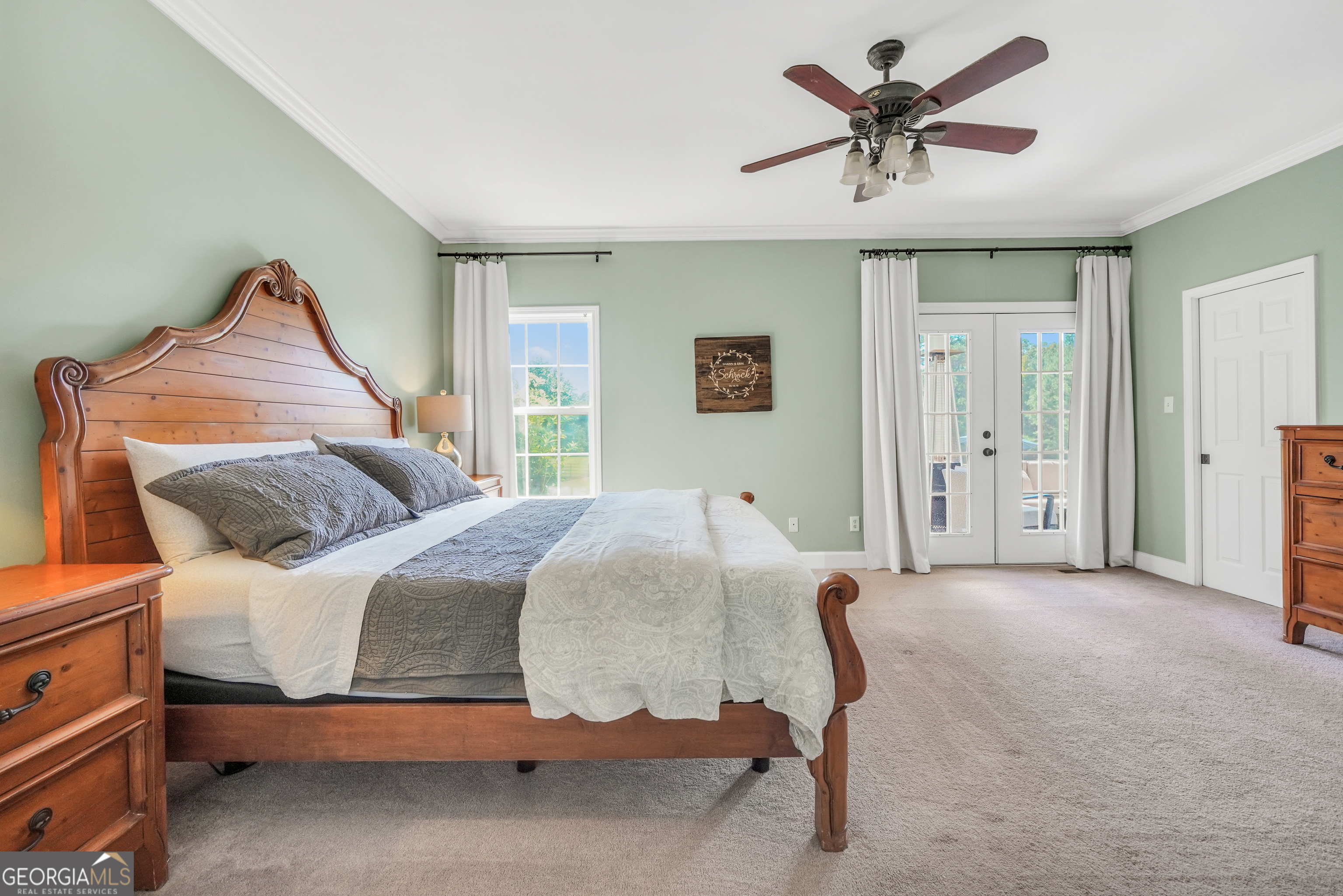 1964 East Lake Road McDonough, GA 30252 - Photo 36 of 99 a bedroom with a bed and a chandelier