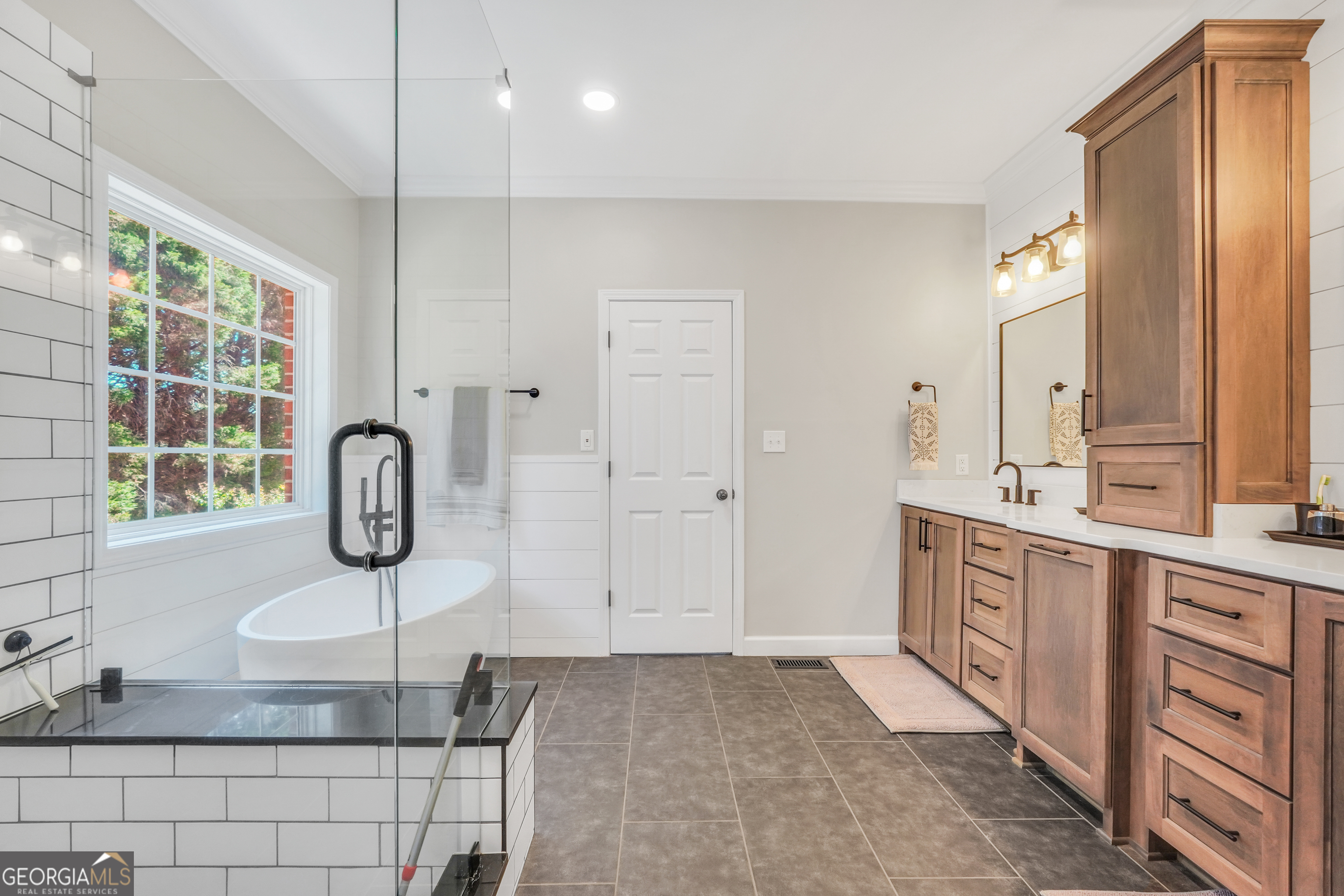 1964 East Lake Road McDonough, GA 30252 - Photo 40 of 99 a spacious bathroom with a granite countertop sink a mirror and shower