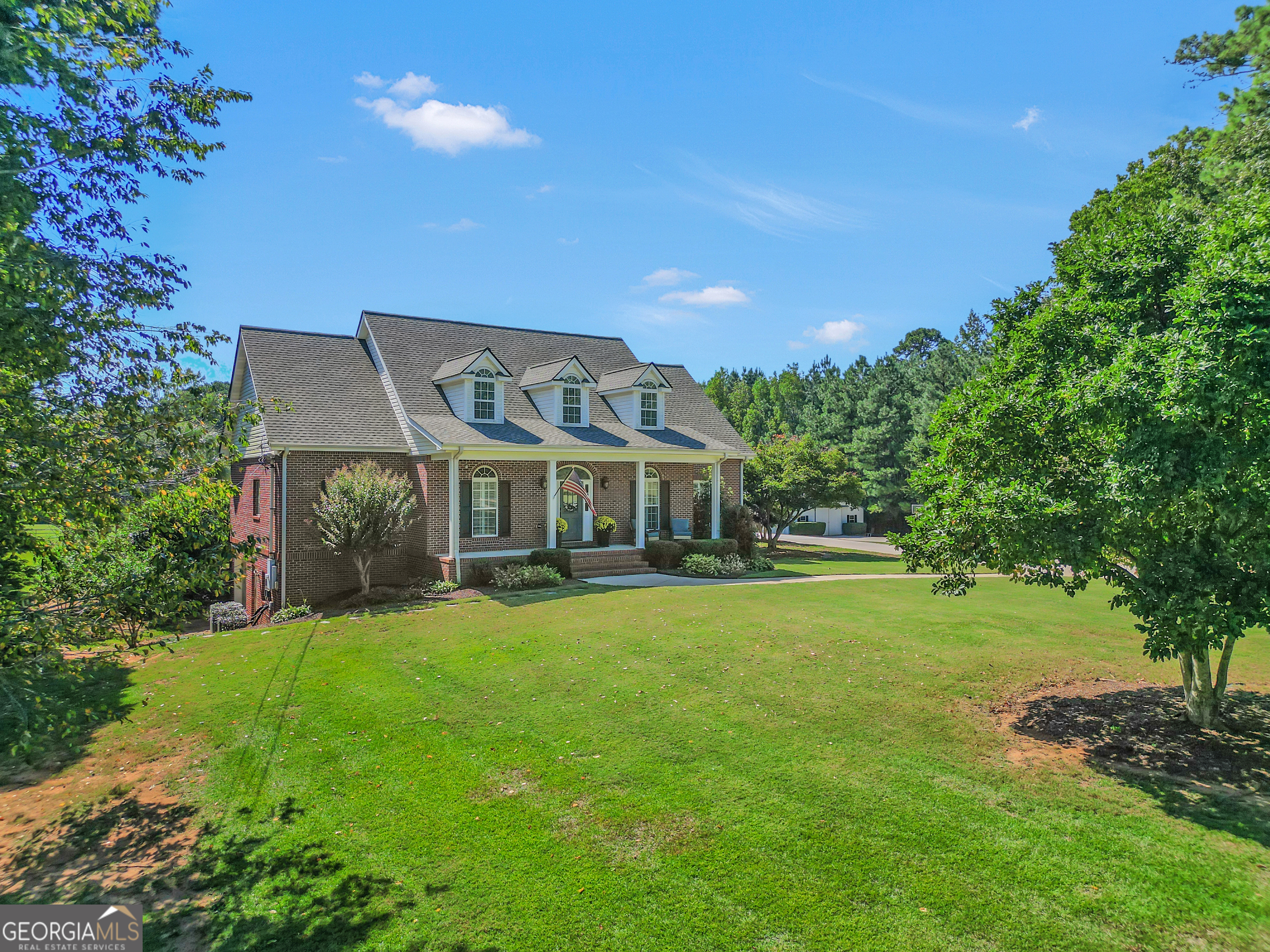 1964 East Lake Road McDonough, GA 30252 - Photo 5 of 99 a front view of a house with a big yard