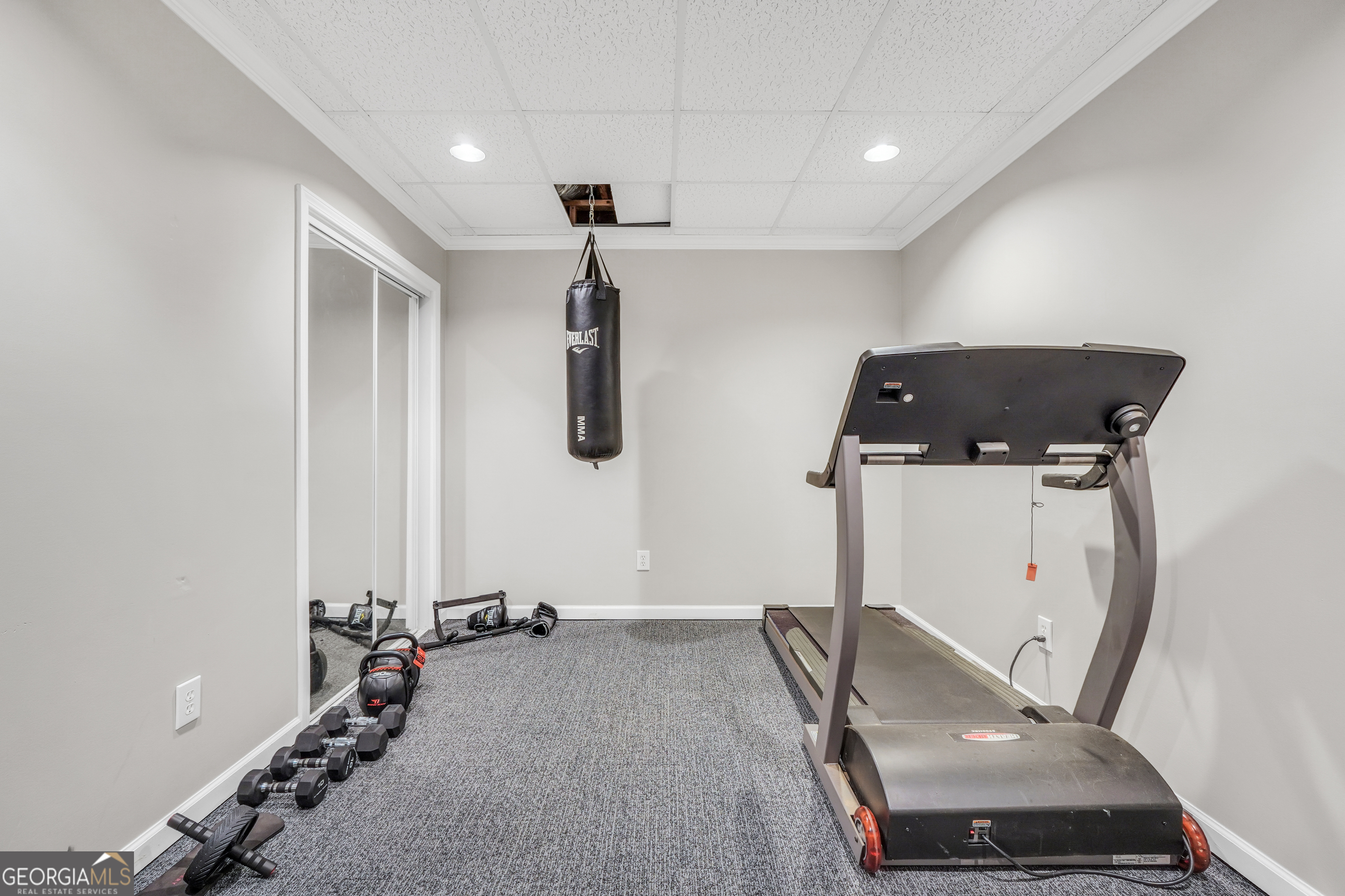 1964 East Lake Road McDonough, GA 30252 - Photo 62 of 99 a room with gym equipment and a window