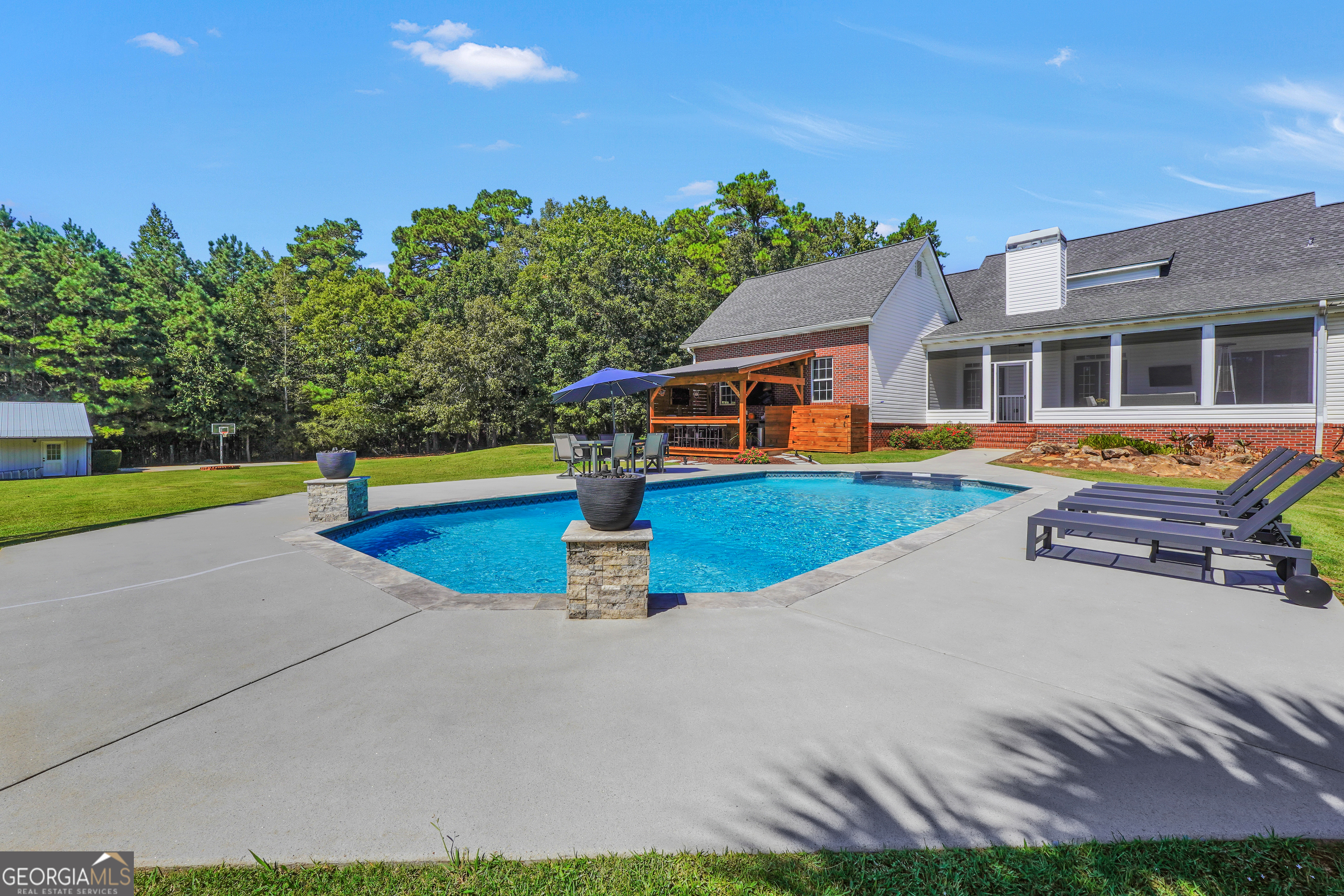 1964 East Lake Road McDonough, GA 30252 - Photo 78 of 99 a swimming pool with outdoor seating and yard