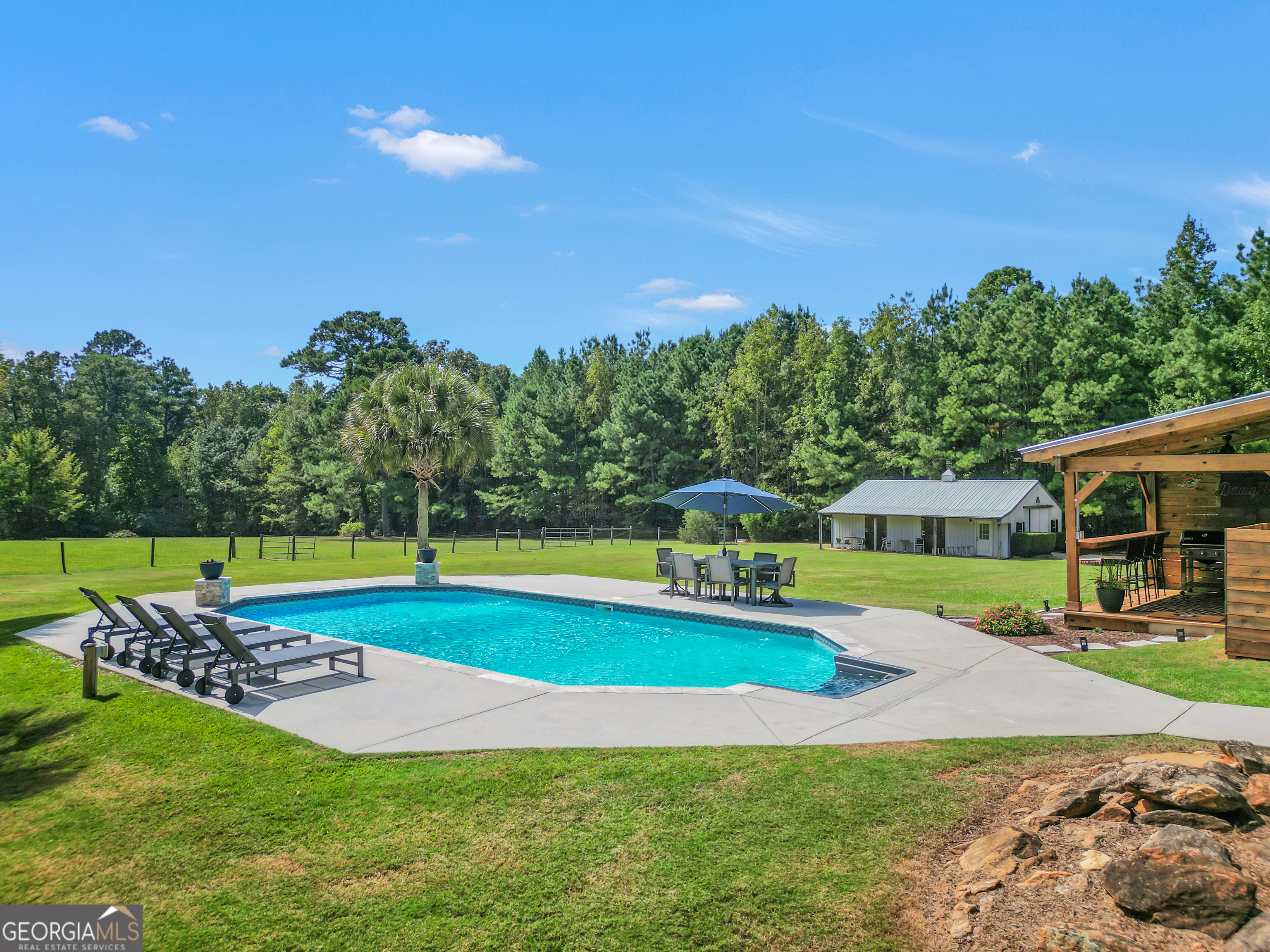 1964 East Lake Road McDonough, GA 30252 - Photo 82 of 99 a view of a house with swimming pool and yard