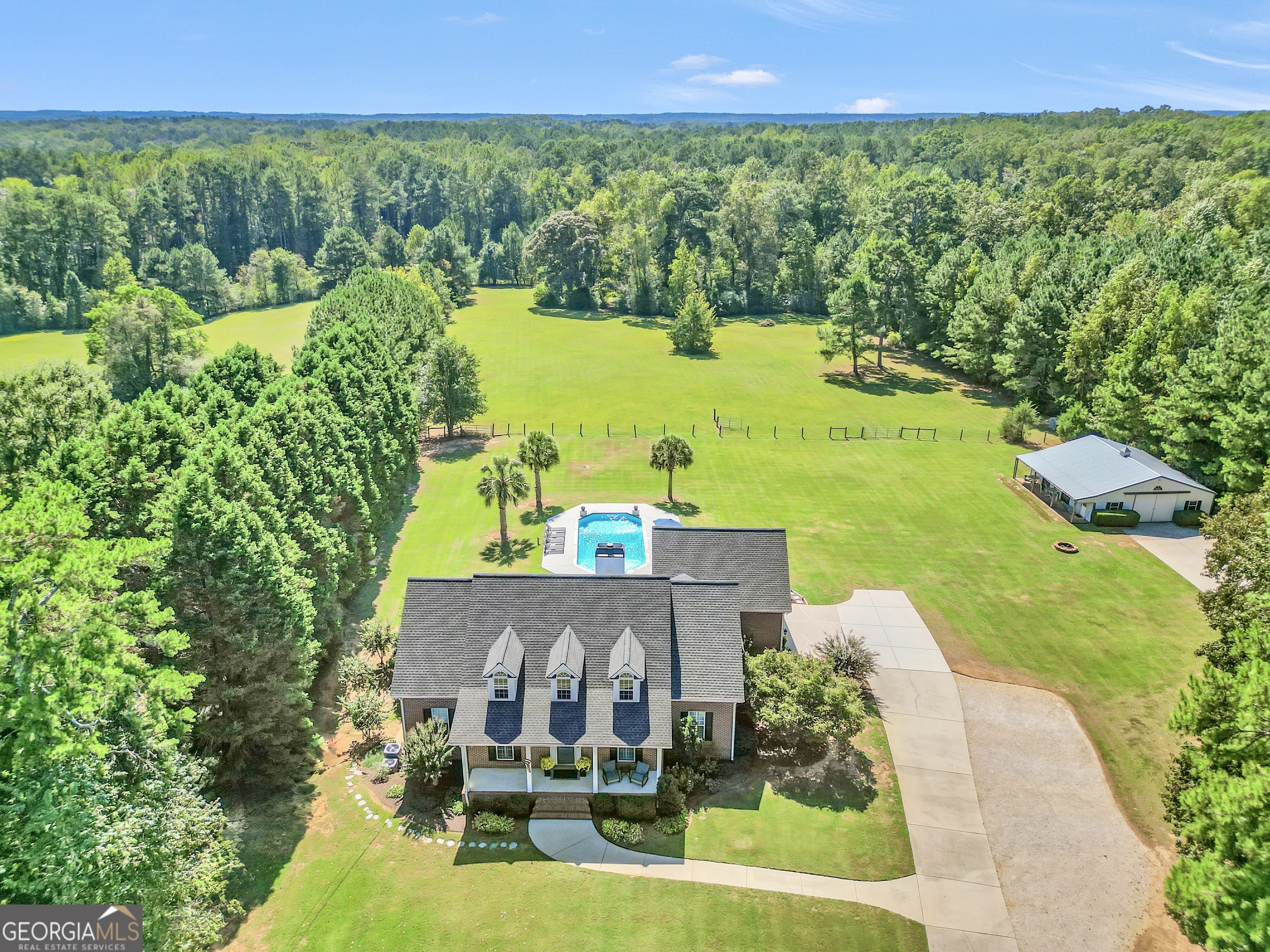 1964 East Lake Road McDonough, GA 30252 - Photo 94 of 99 an aerial view of a house with garden space and outdoor seating