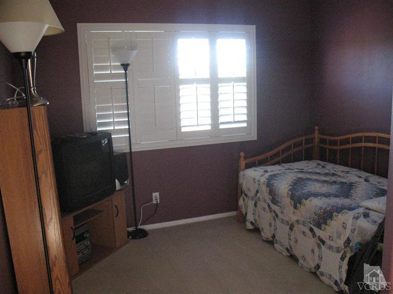1420 Quincy Street Oxnard, CA 93033 - Photo 17 of 27 a bedroom with a bed and a window