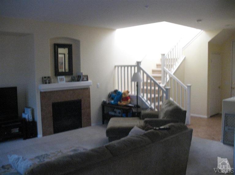 1420 Quincy Street Oxnard, CA 93033 - Photo 3 of 27 a living room with furniture and a fireplace
