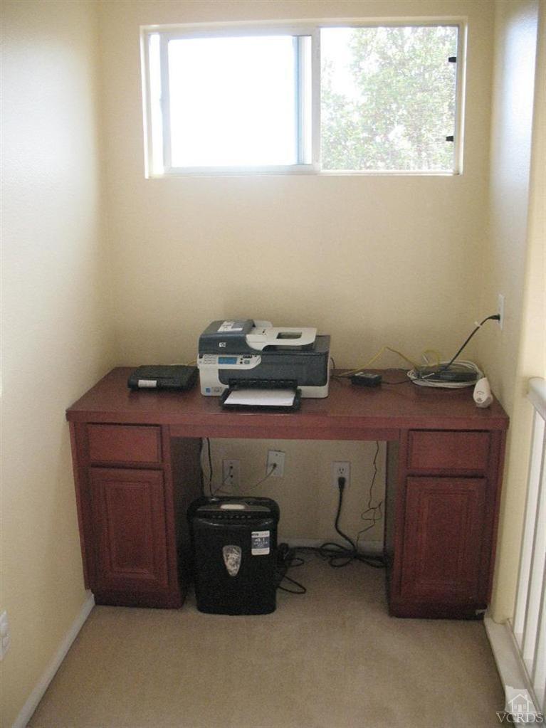 1420 Quincy Street Oxnard, CA 93033 - Photo 23 of 27 a room with a fireplace and a window