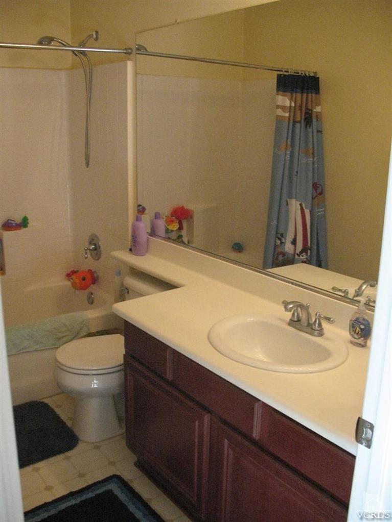 1420 Quincy Street Oxnard, CA 93033 - Photo 24 of 27 a bathroom with a sink toilet and shower