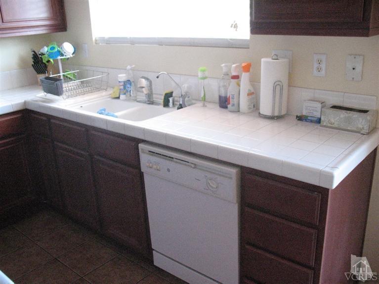 1420 Quincy Street Oxnard, CA 93033 - Photo 7 of 27 a bathroom with a sink and a mirror