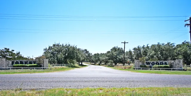 a view of a yard with basketball court