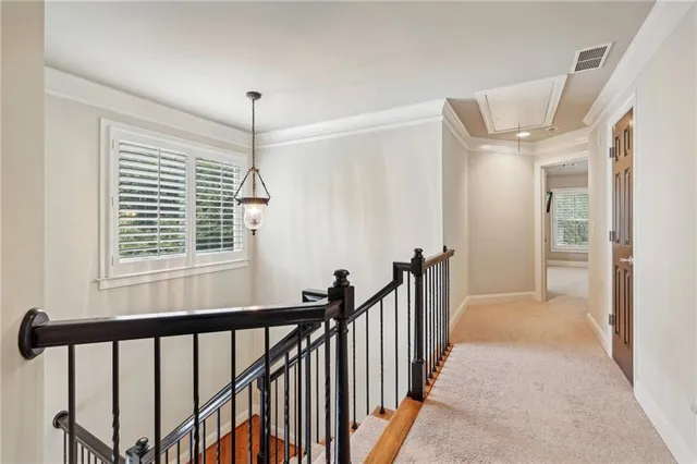 a view of a hallway with windows