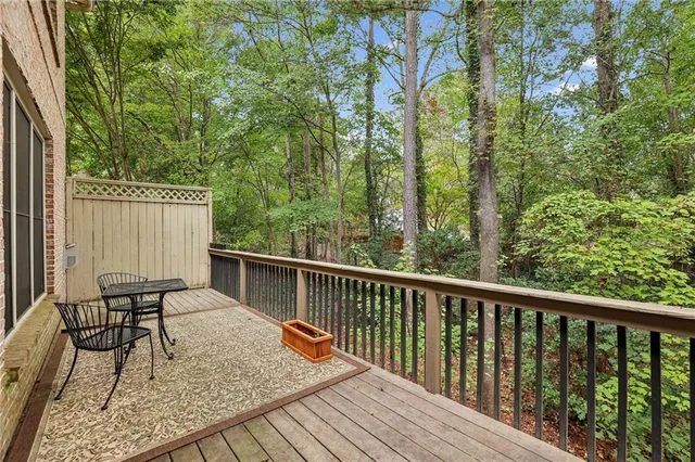 a view of balcony with furniture and trees