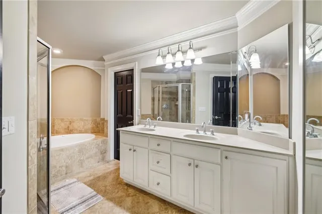 a bathroom with a double vanity sink and a mirror