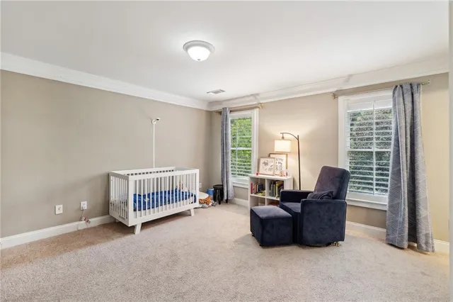 a bedroom with furniture and windows