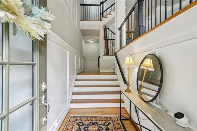 a view of staircase with a front door