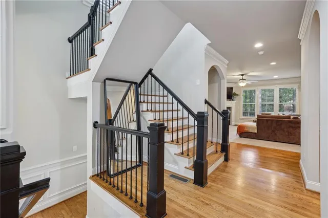 a view of entryway and hall with wooden floor